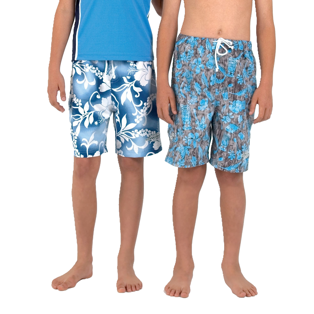 Two kids wearing the Australian-designed Stingray Kids' Unisex Hawaii Board Shorts with UPF 50+ sun protection, featuring a side pocket and drawstring. Colourways shown are two different blue hawaii patterns.