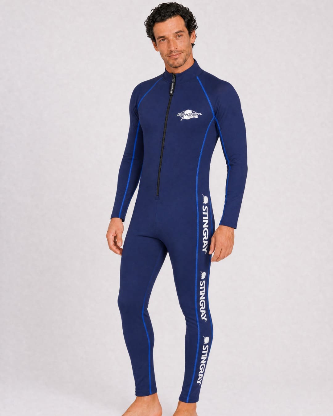 Man wearing a navy full body UV swimsuit UPF 50+ in a white studio
