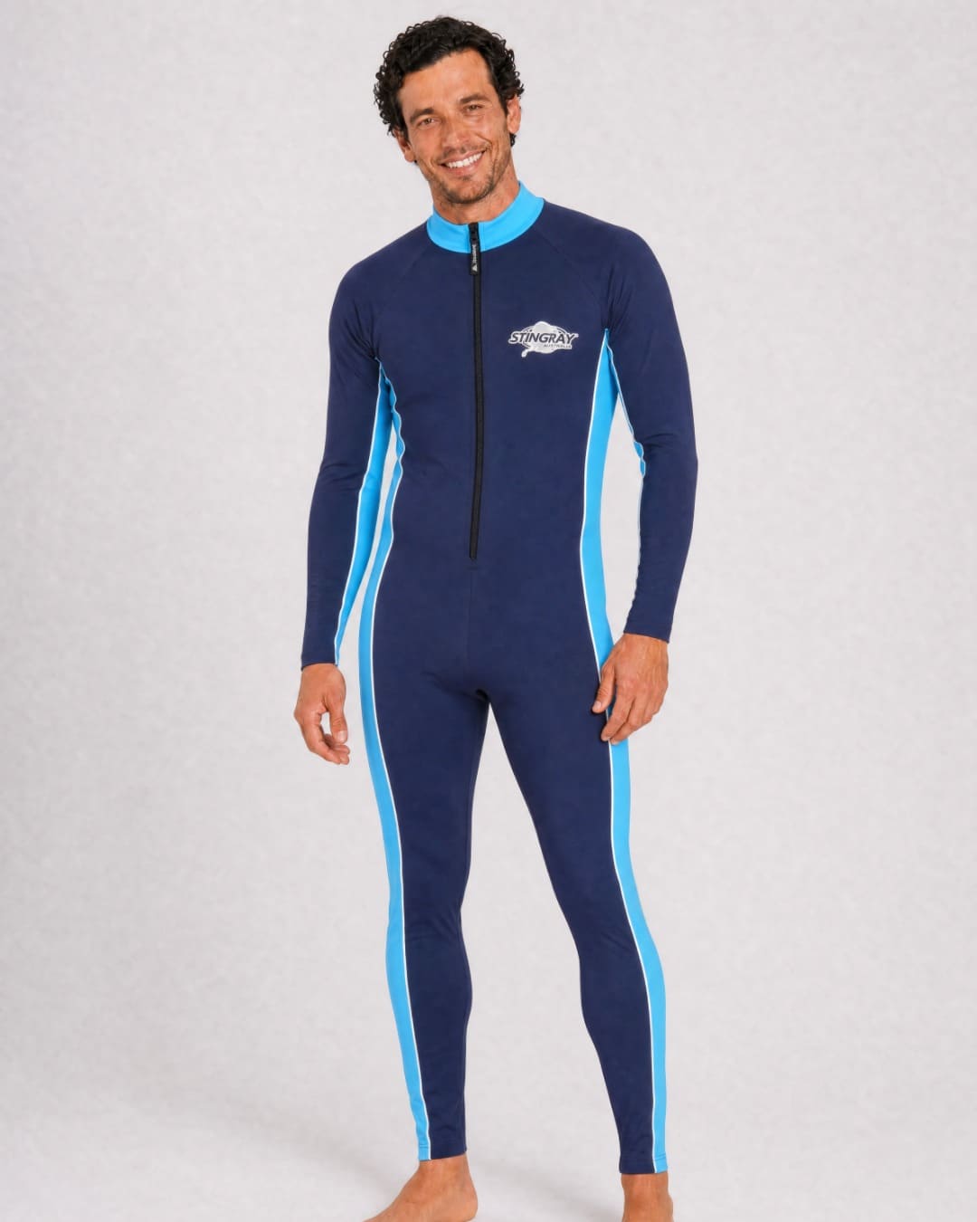 Man wearing a full body navy and azure UV swimsuit UPF 50+ in a white studio
