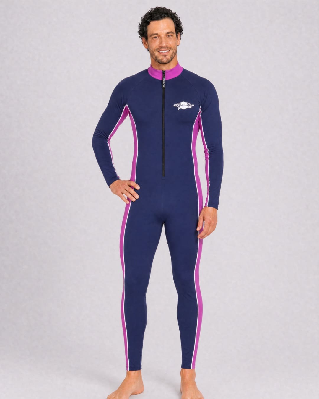 Man wearing a navy and purple full body UV swimsuit UPF 50+ in a white studio