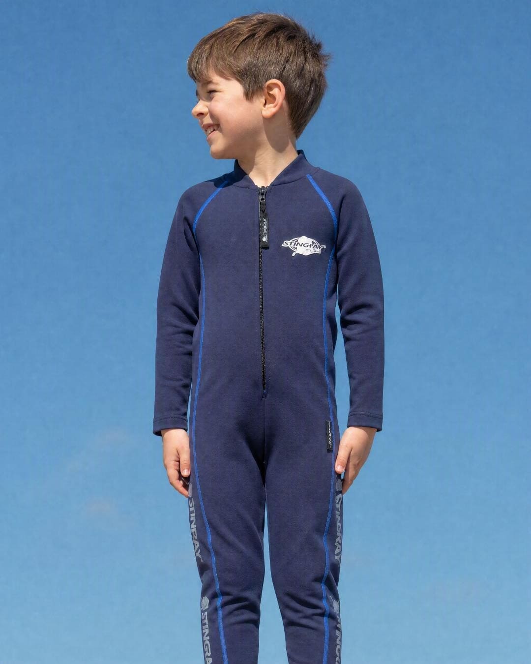 Lifestyle of 6 Year Old Boy in Full Body Sunsuit - Navy Blue Stitching