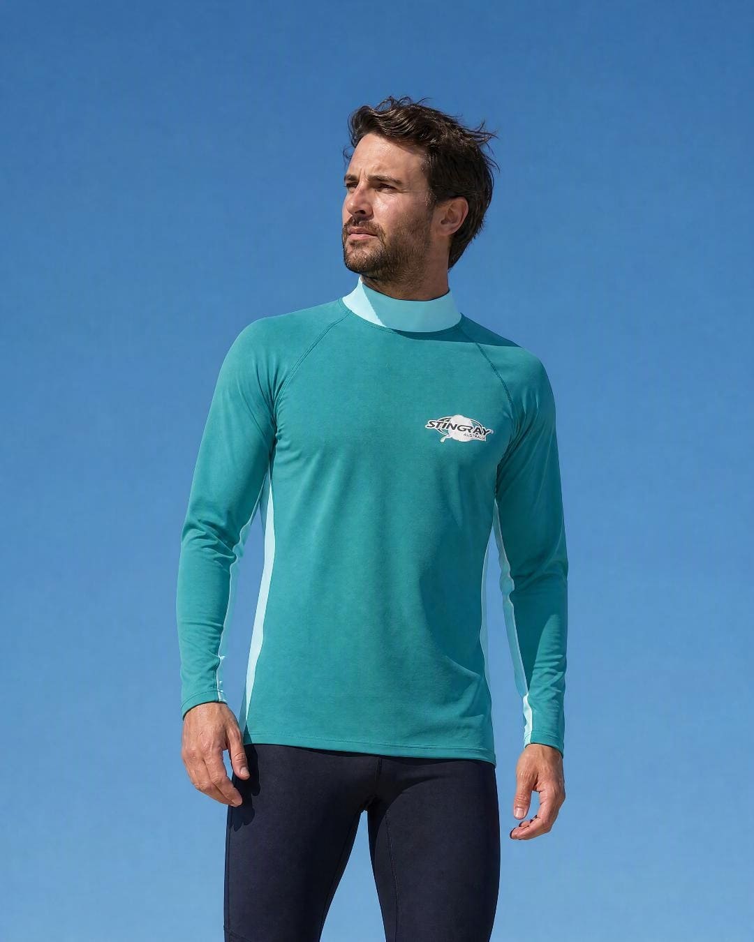 Lifestyle of Man Wearing Long Sleeve UV Rash Shirt UPF 50+ in Aqua Teal