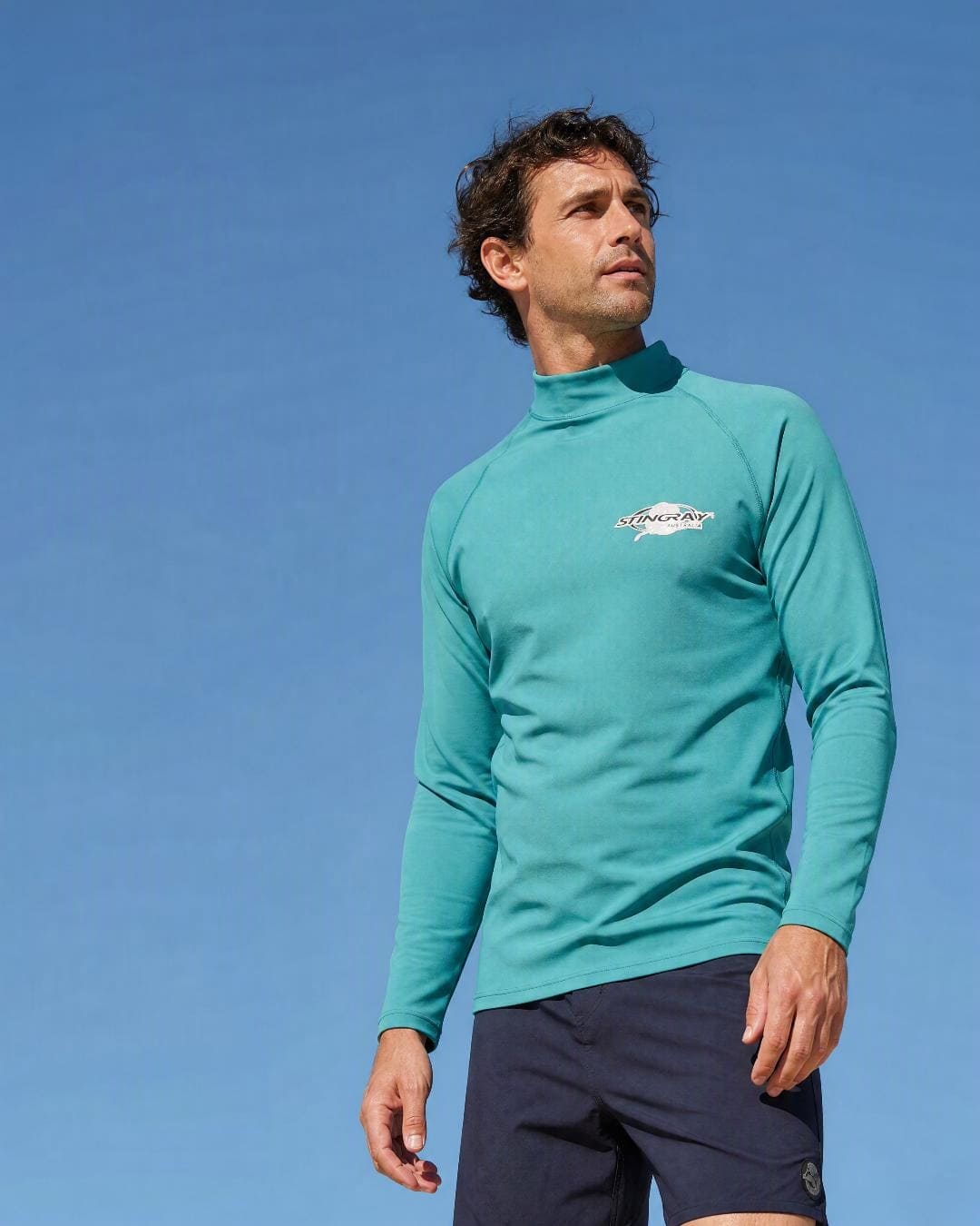 Lifestyle of Man Wearing Long Sleeve UV Rash Shirt UPF 50+ in Teal