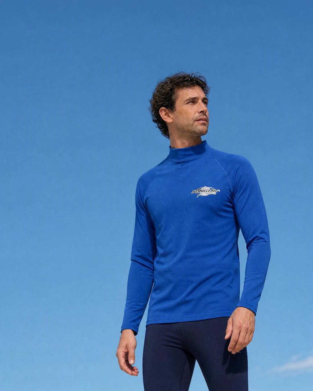 Lifestyle of Man Wearing Long Sleeve UV Swim Shirt UPF 50+ in Ocean Blue