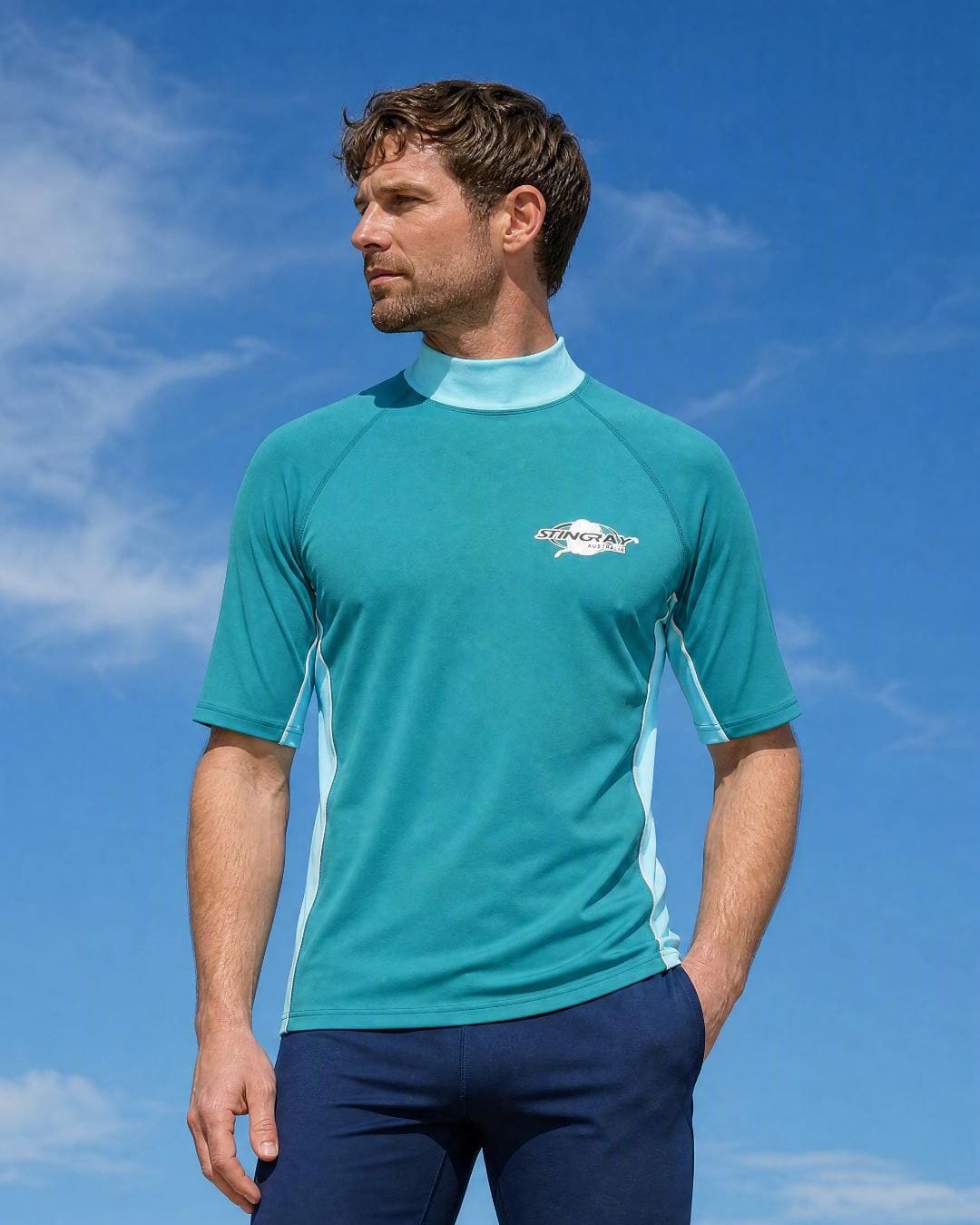 Lifestyle of Man Wearing Short Sleeve UV Rash Shirt UPF 50+ in Aqua Teal