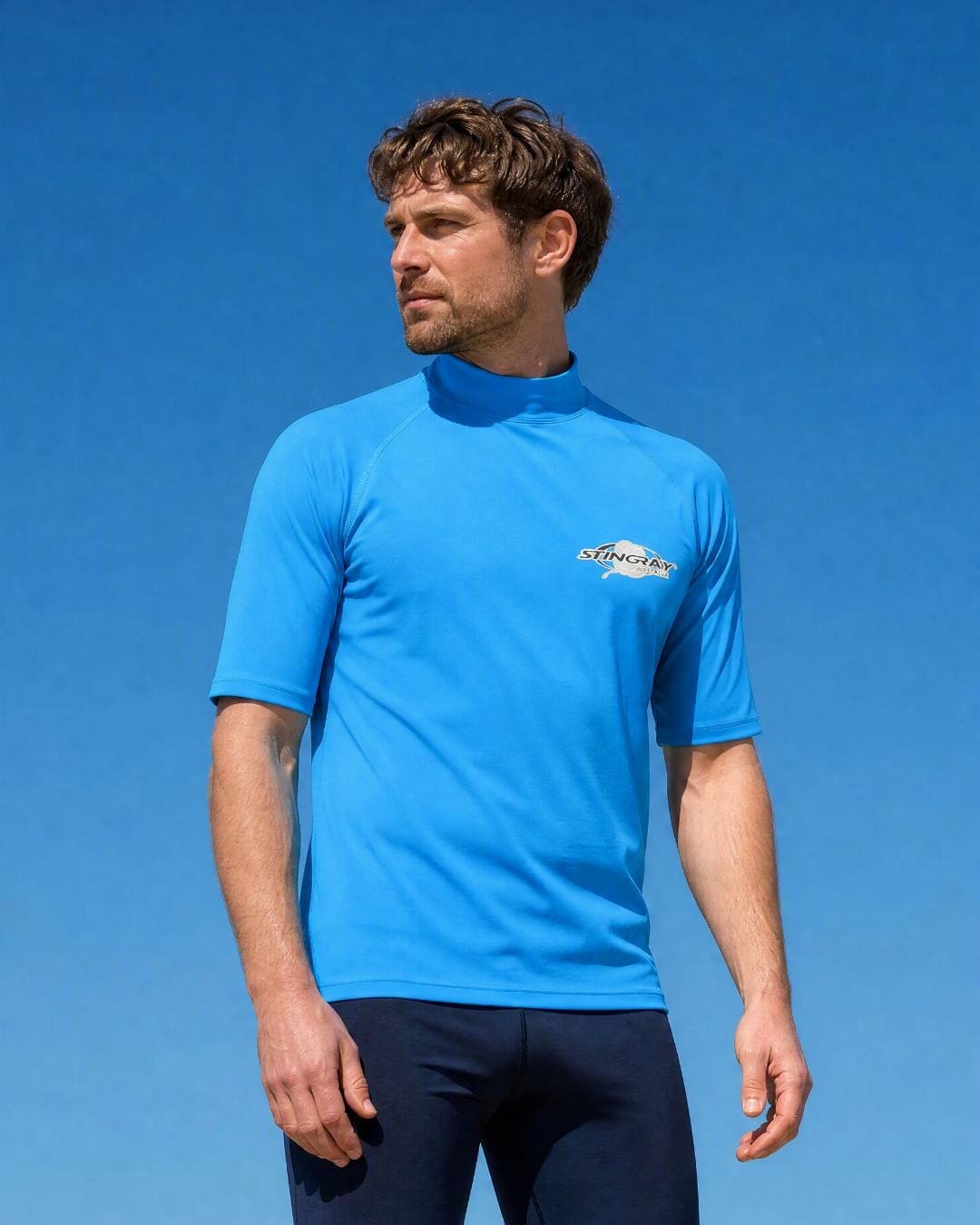 Lifestyle of Man Wearing Short Sleeve UV Rash Shirt UPF 50+ in Azure