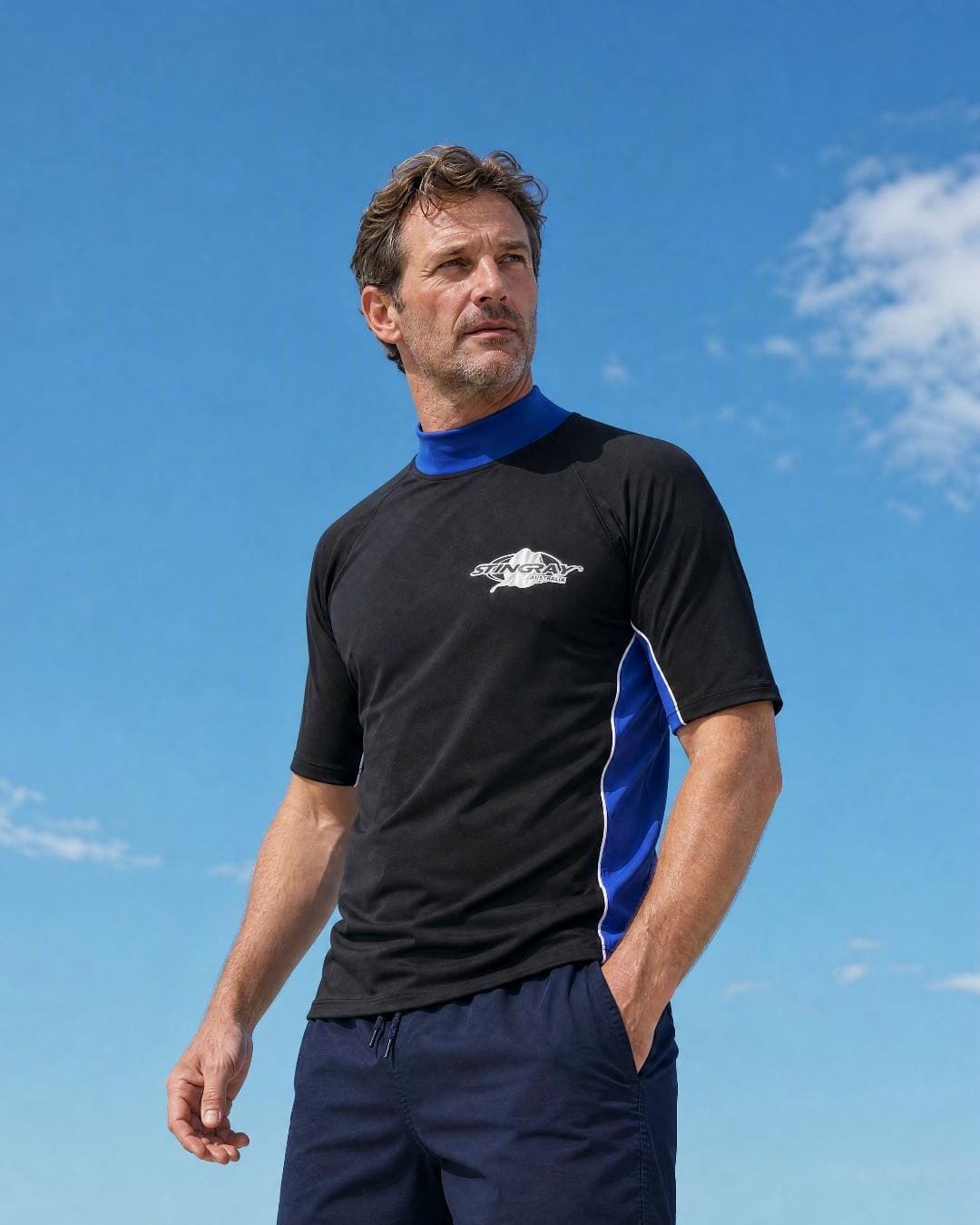 Lifestyle of Man Wearing Short Sleeve UV Swim Shirt UPF 50+ in Black Ocean Blue