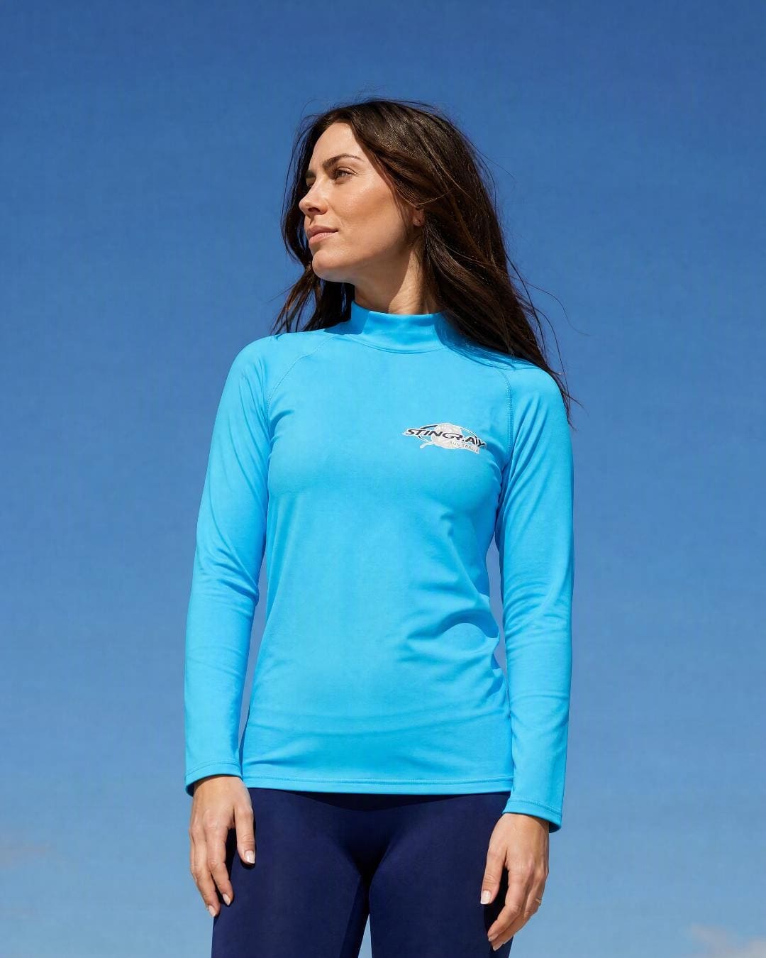 Lifestyle of Woman Wearing Long Sleeve UV Rash Shirt UPF 50+ in Azure