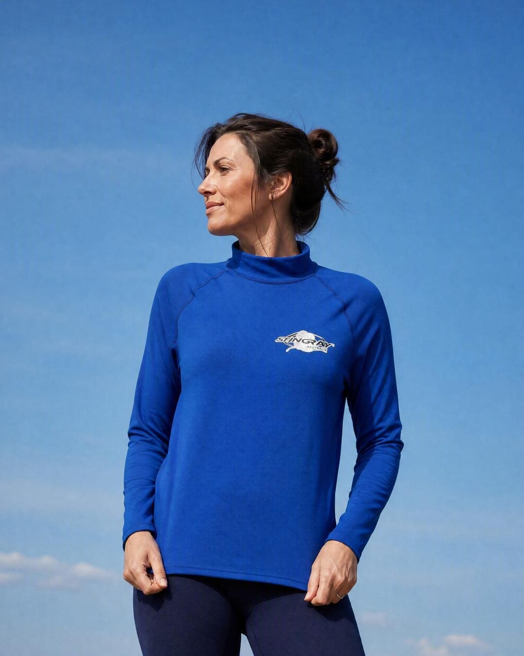 Lifestyle of Woman Wearing Long Sleeve UV Swim Shirt UPF 50+ in Ocean Blue