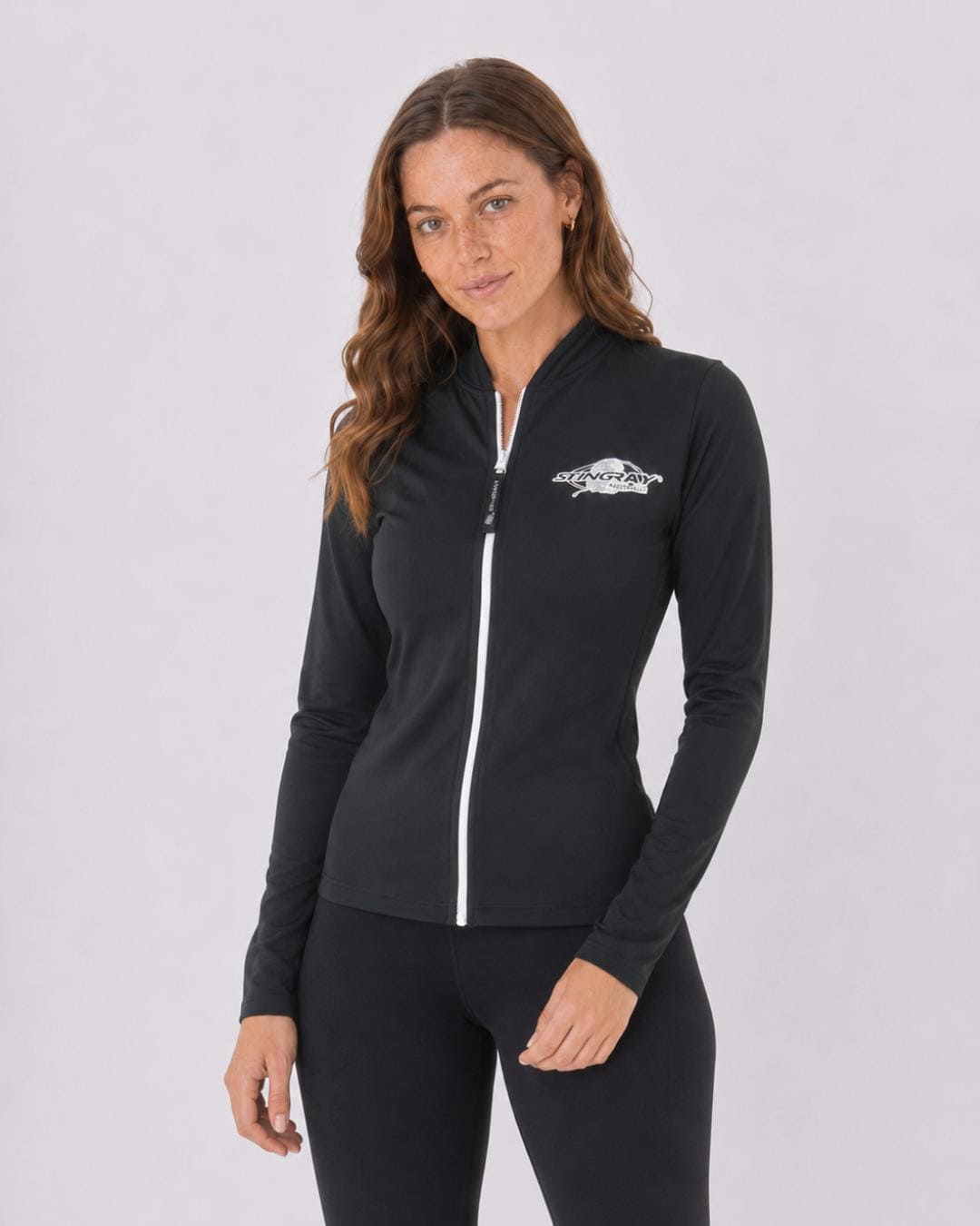 Woman wearing a black UV jacket UPF 50+ on a white background