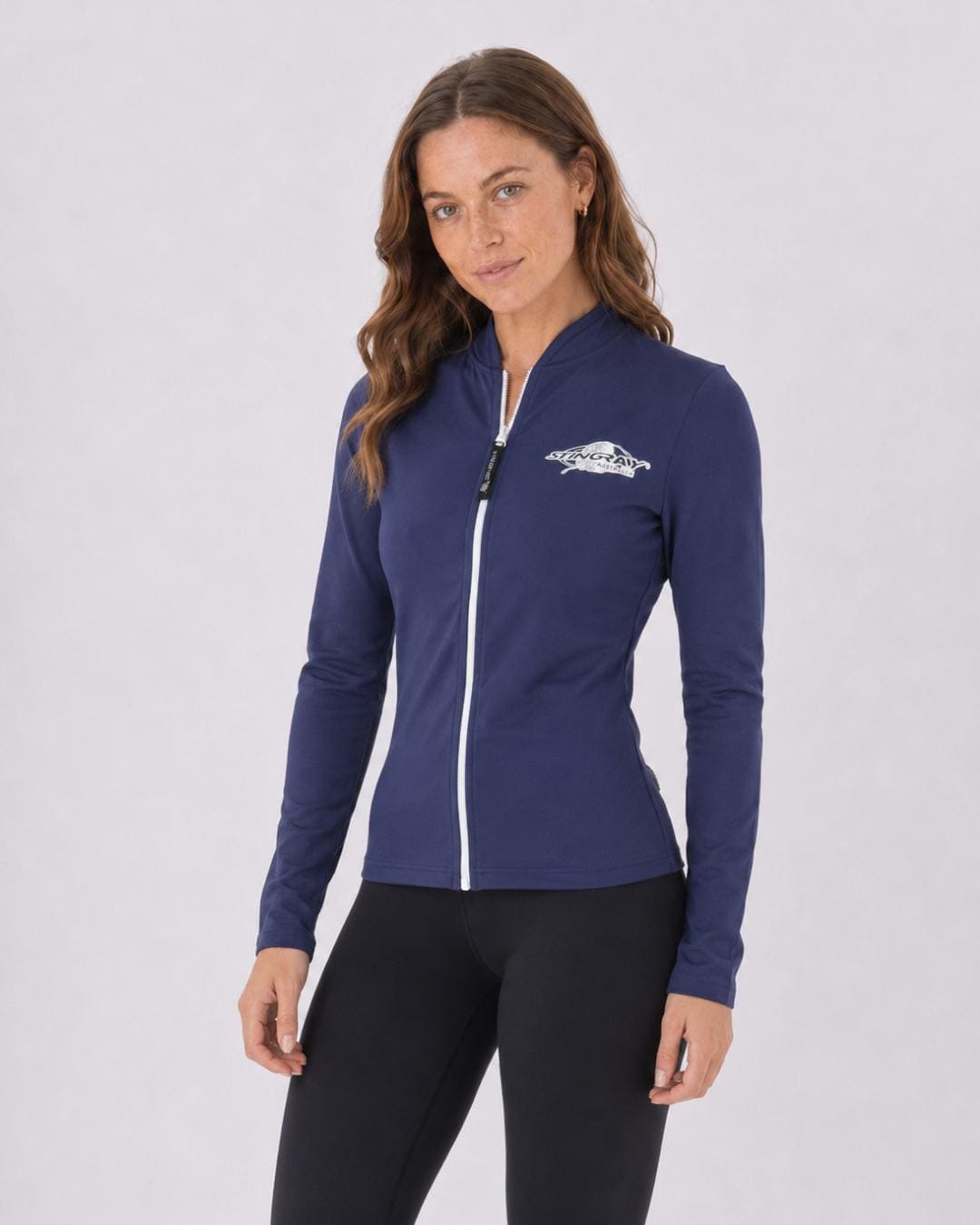 Woman wearing a navy blue UV jacket UPF 50+ on a white background