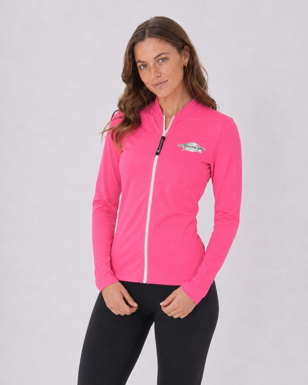 Woman wearing a pink UV jacket UPF 50+ on a white background