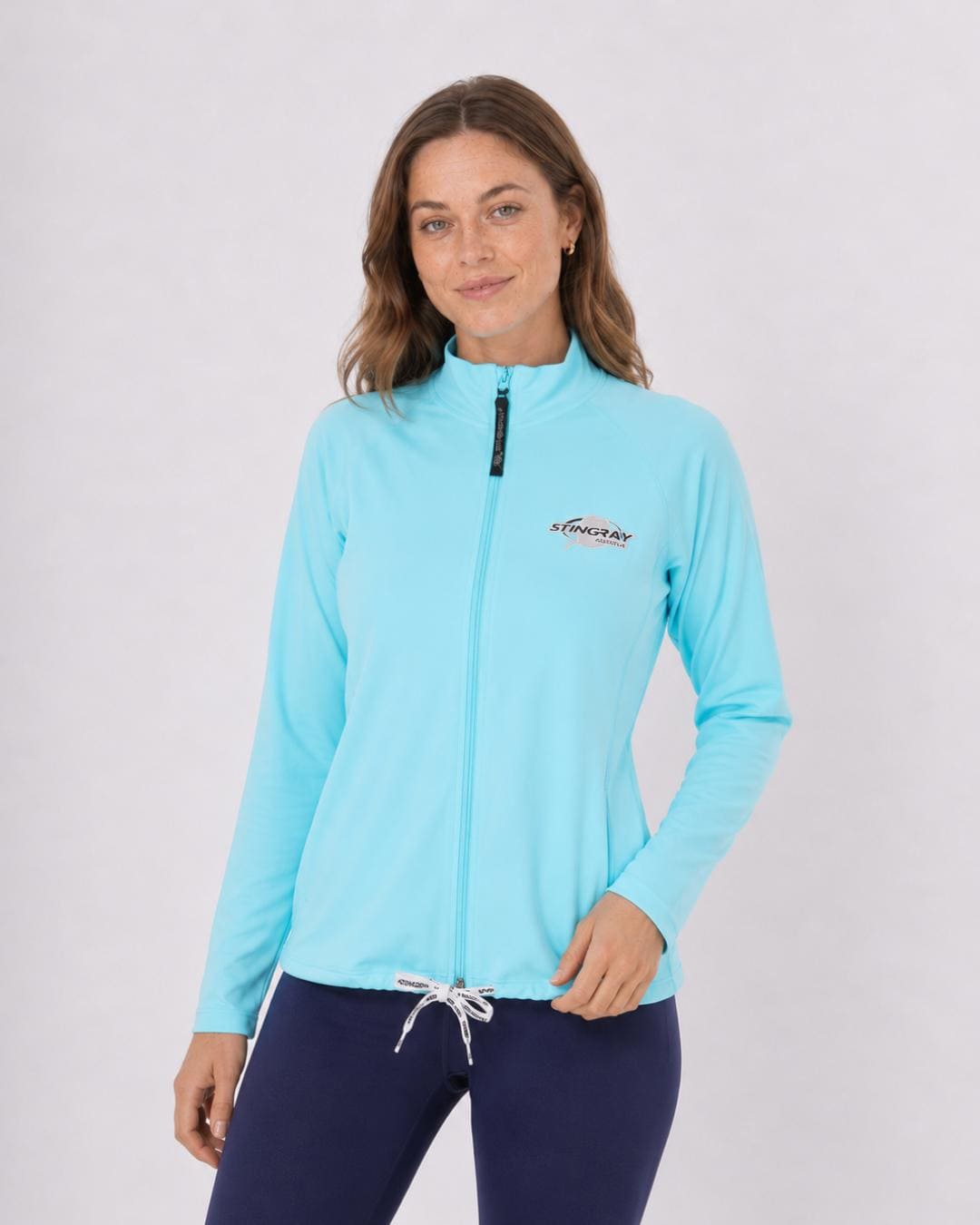 Woman wearing a aqua long sleeve UV jacket UPF 50+ on a white background