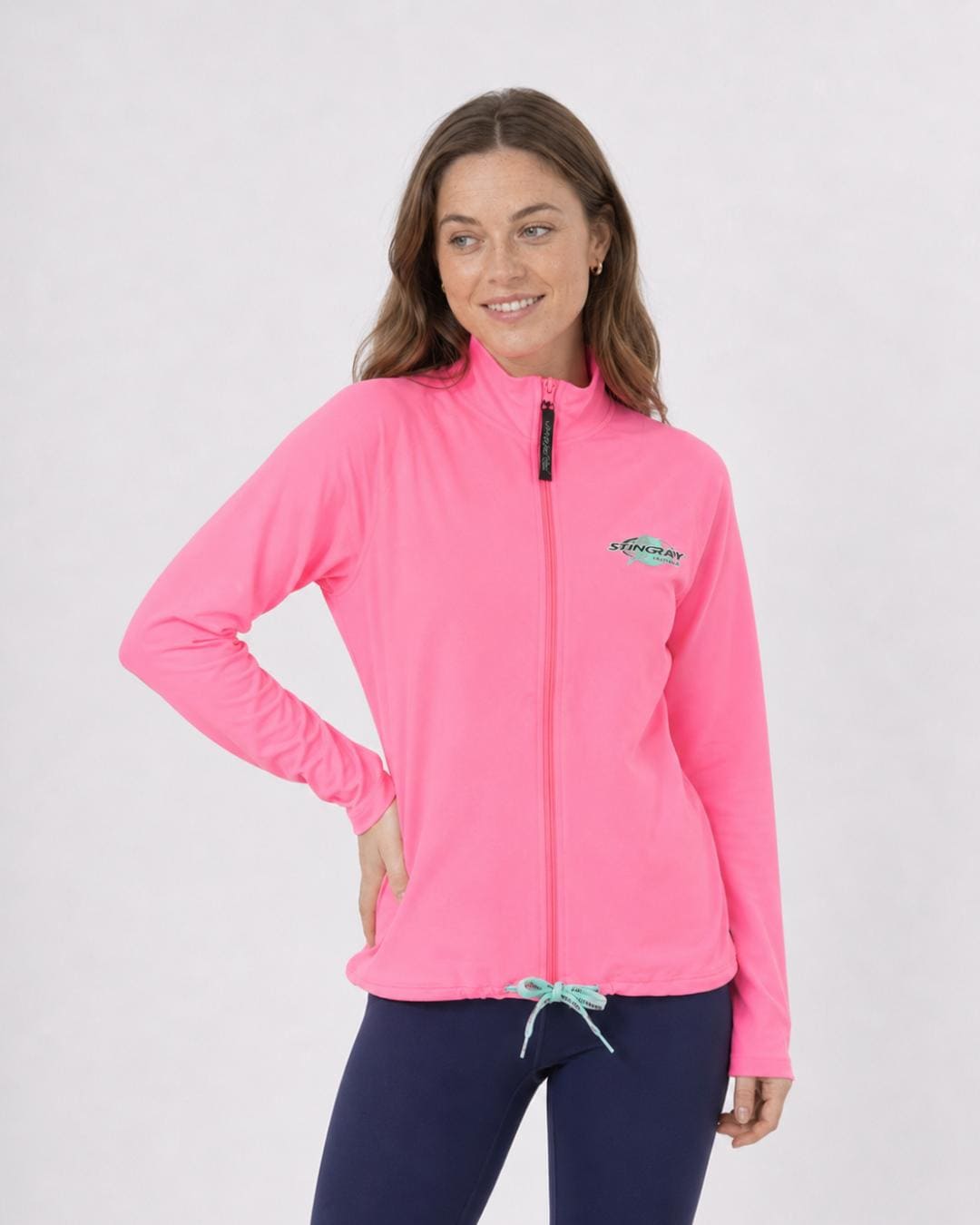 Woman wearing a pink long sleeve UV jacket UPF 50+ on a white background