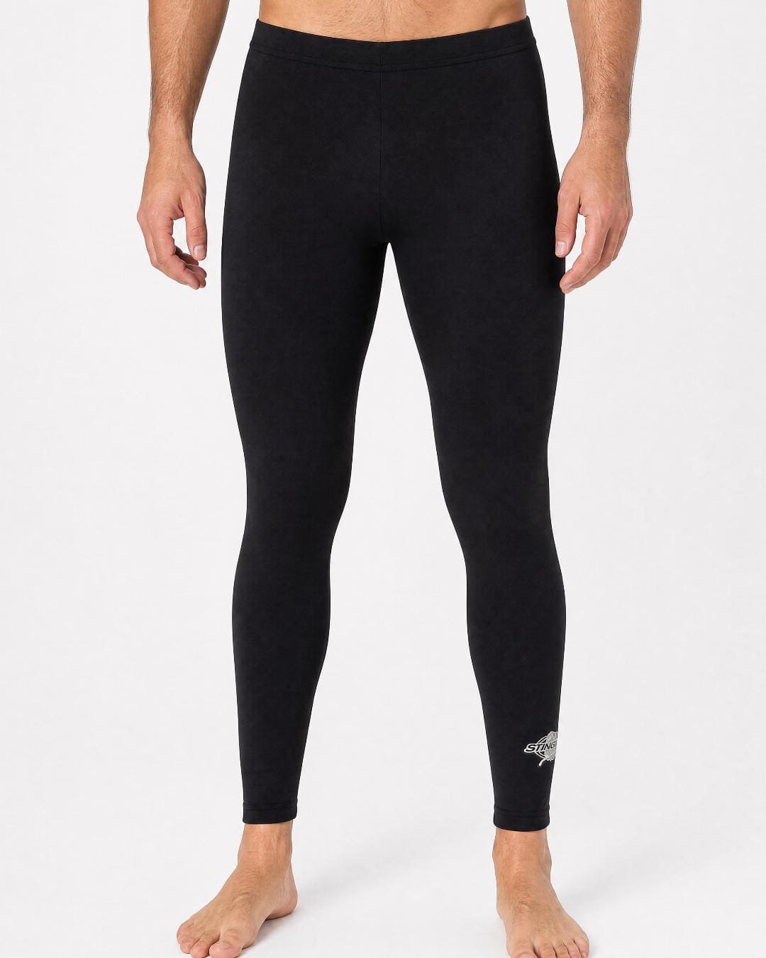 Man wearing UV swim leggings/tight UPF 50+ in black in a white studio