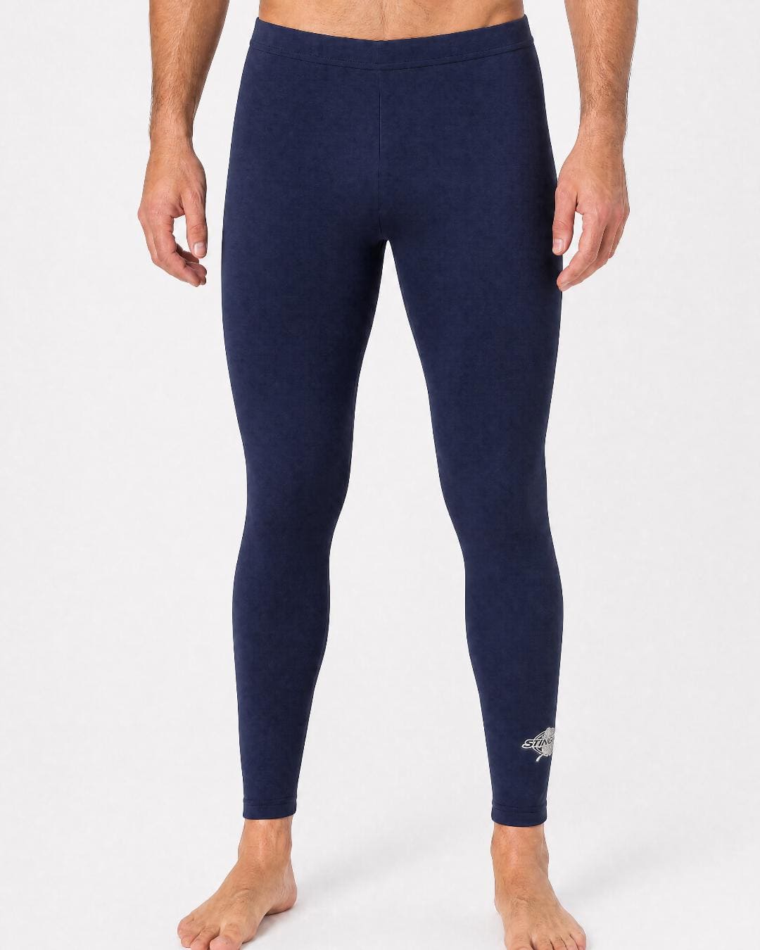Man wearing UV swim leggings/tight UPF 50+ in navy in a white studio