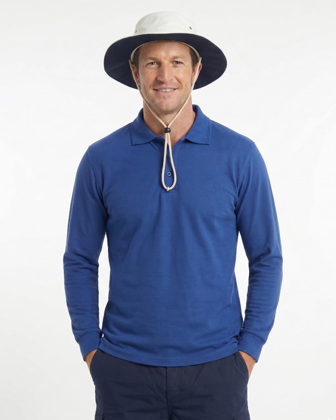 Man wearing a UV cricket hat UPF 50+ in a white studio