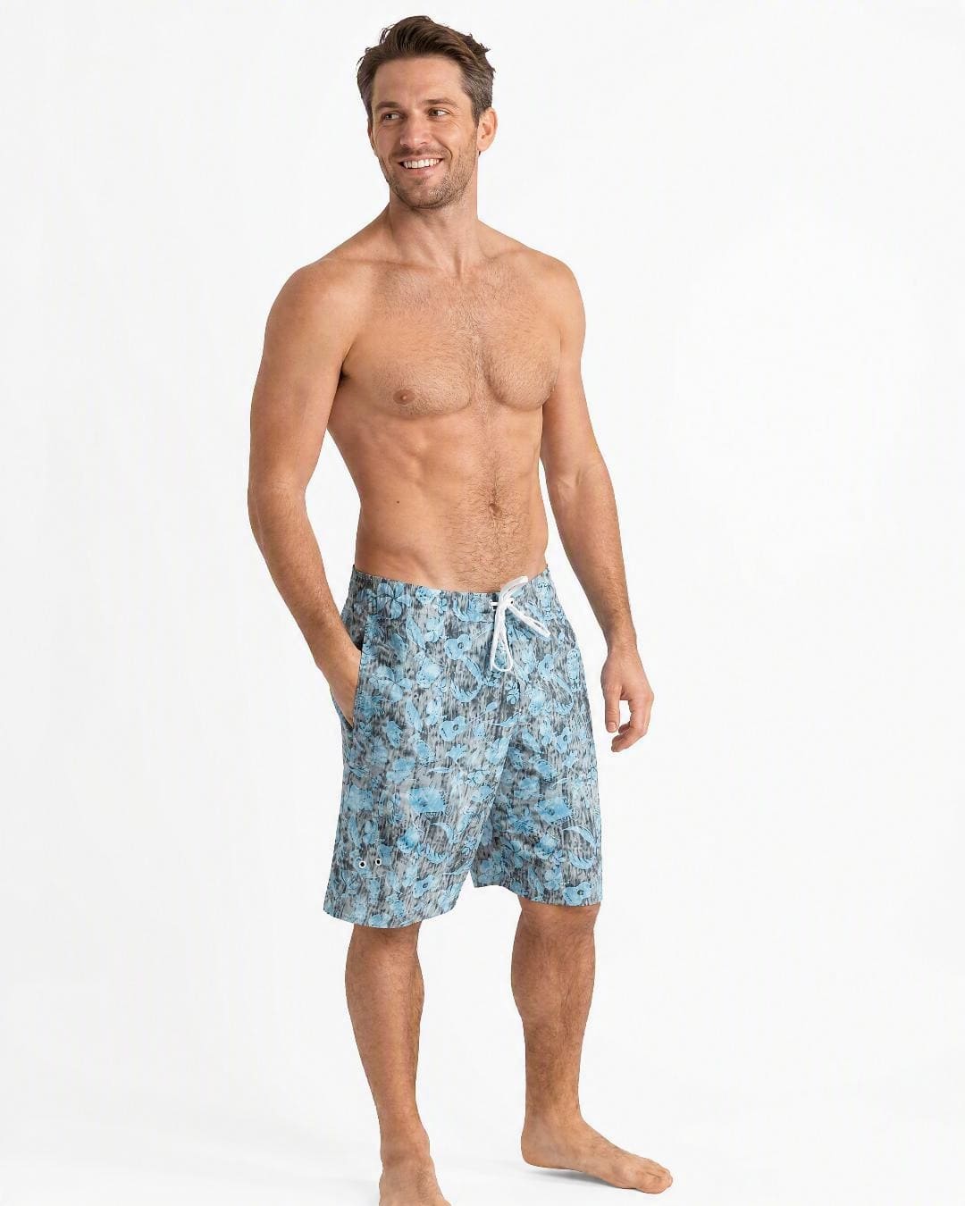 Man wearing the Stingray Tribal UV Board Shorts UPF 50+ in the studio