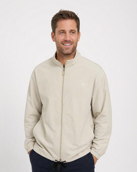 Man wearing the Stingray UV vented jacket UPF 50+ in bone, in the studio