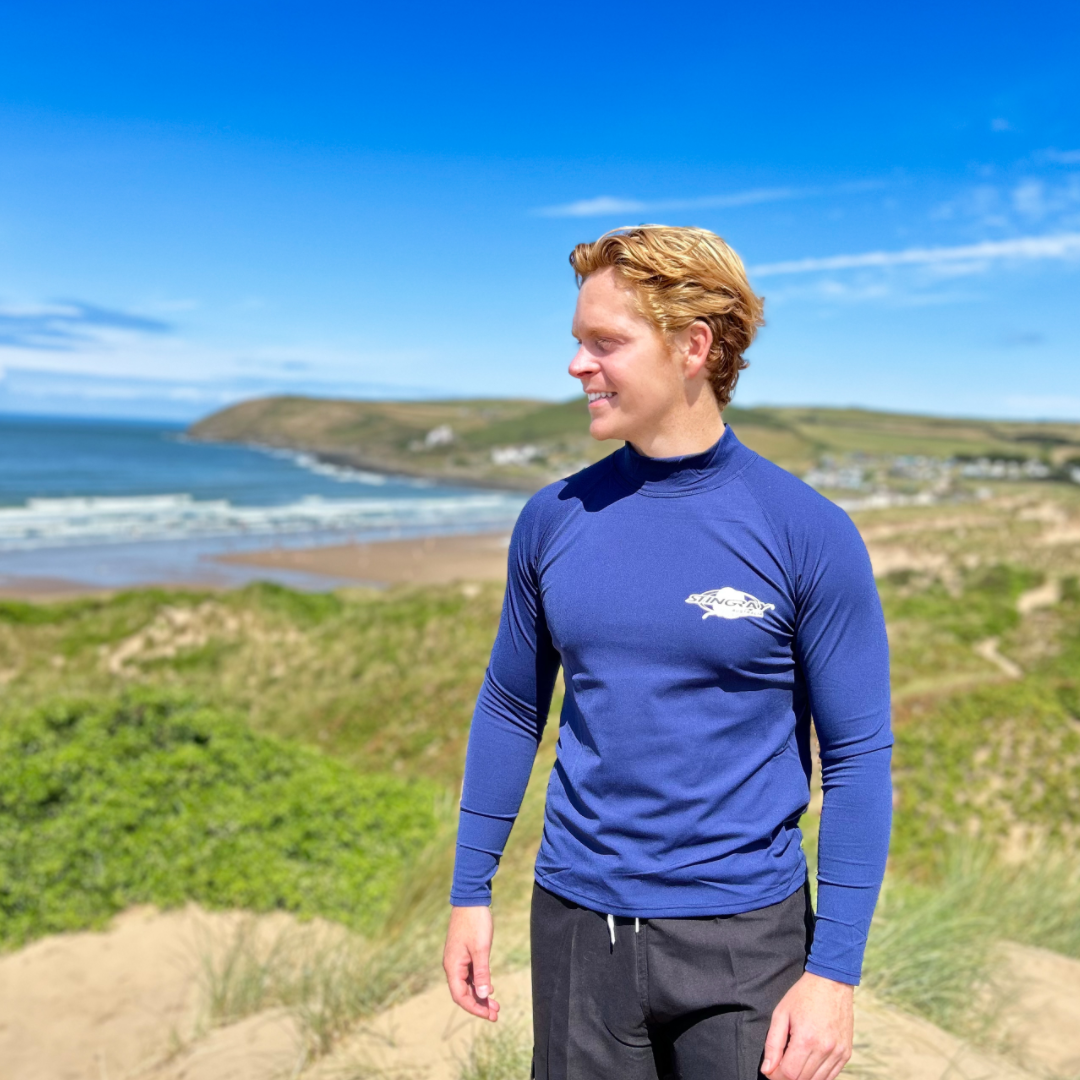 Man wearing a blue upf50 long-sleeve rash shirt.