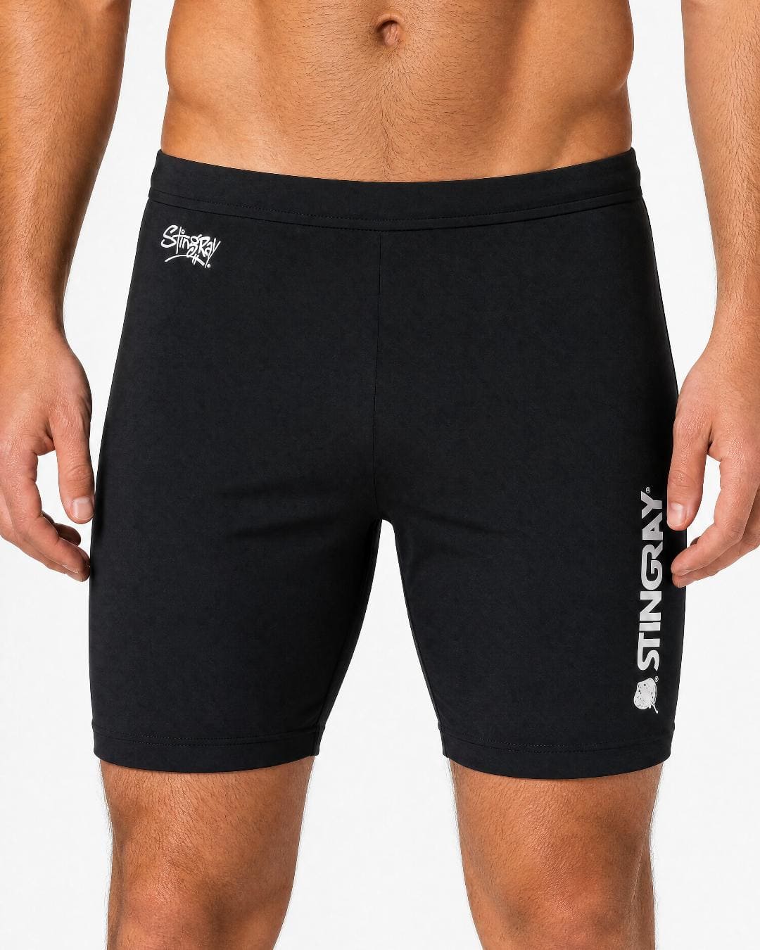 Man wearing black UV swim shorts UPF 50+ in a white studio