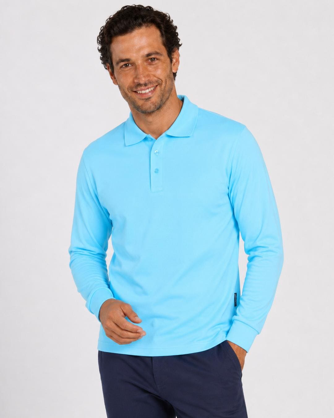 Man wearing a light blue long-sleeve UV polo shirt on a white background