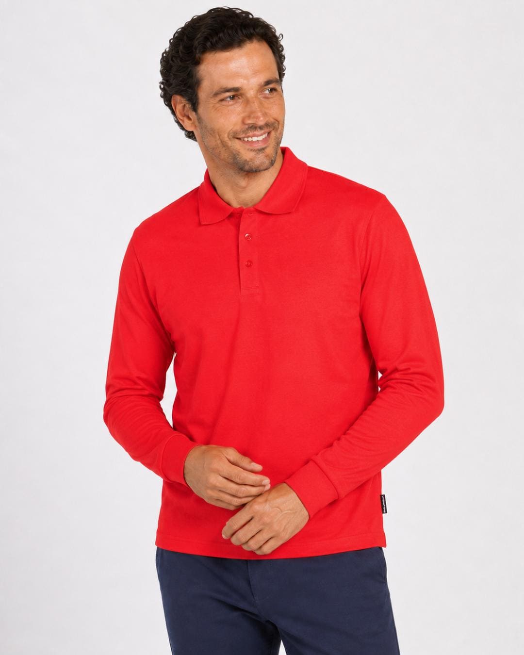 Man wearing a red long-sleeve UV polo shirt on a white background
