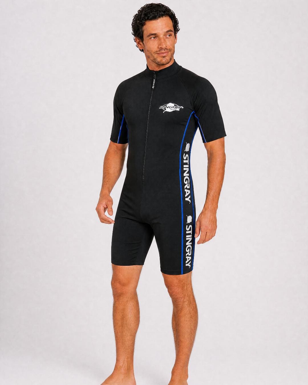 Man wearing a black UV full body swimsuit UPF 50+ on a white background
