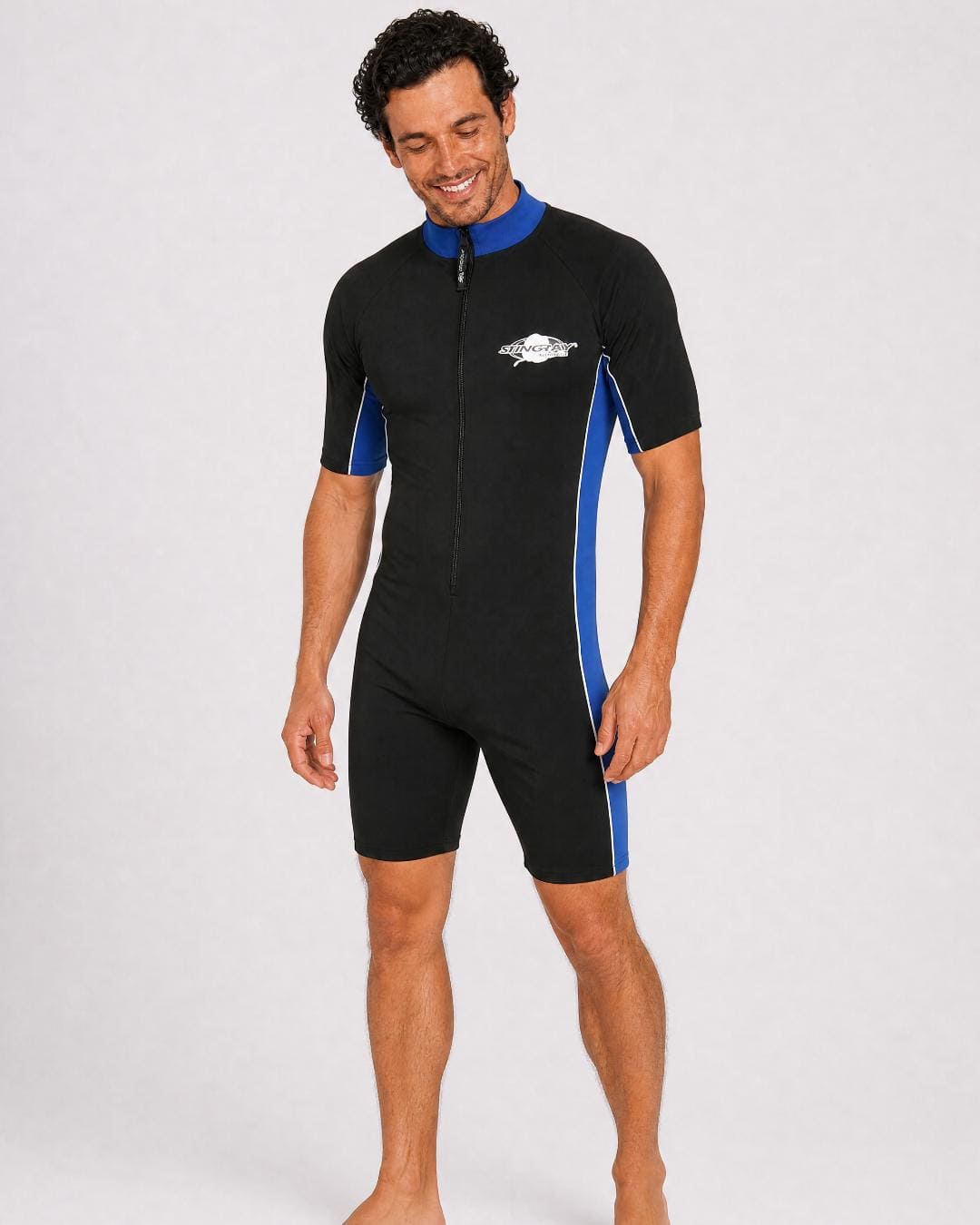 Man wearing a black and blue UV full body swimsuit UPF 50+ on a white background