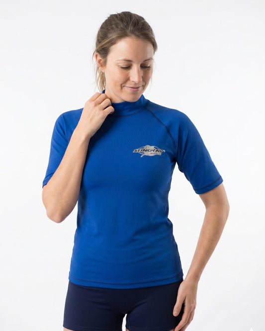 Woman wearing an ocean blue UV swim shirt UPF 50+ on a white background
