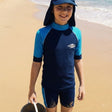 Review pic: 12 year old wearing UPF swim shorts on the beach
