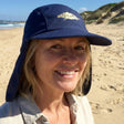 Review pic: 50 year old woman wearing a UPF 50+ legionnaire cap on the beach