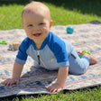 Review pic: baby wearing sunsuit outdoors