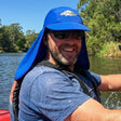 Review pic: man wearing UV protection legionnaire hat whilst kayaking on the river thames