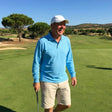 Review pic: man wearing UV protection polo shirt with long sleeves whilst playing golf