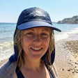 Review pic: woman wearing UV protection legionnaire cap on the beach