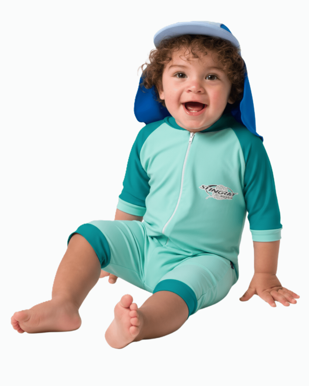 Baby wearing a turquoise sun protection swimsuit with a blue cap on a white background