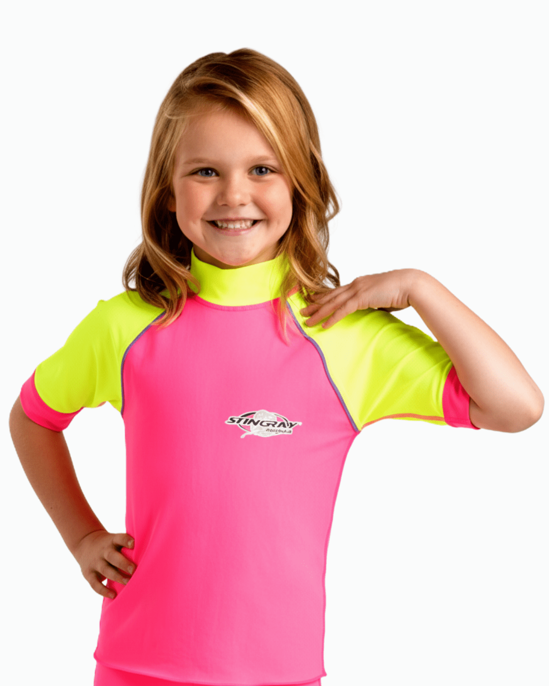 Young girl wearing a pink and yellow upf rash vest with a Stingray logo on a white background
