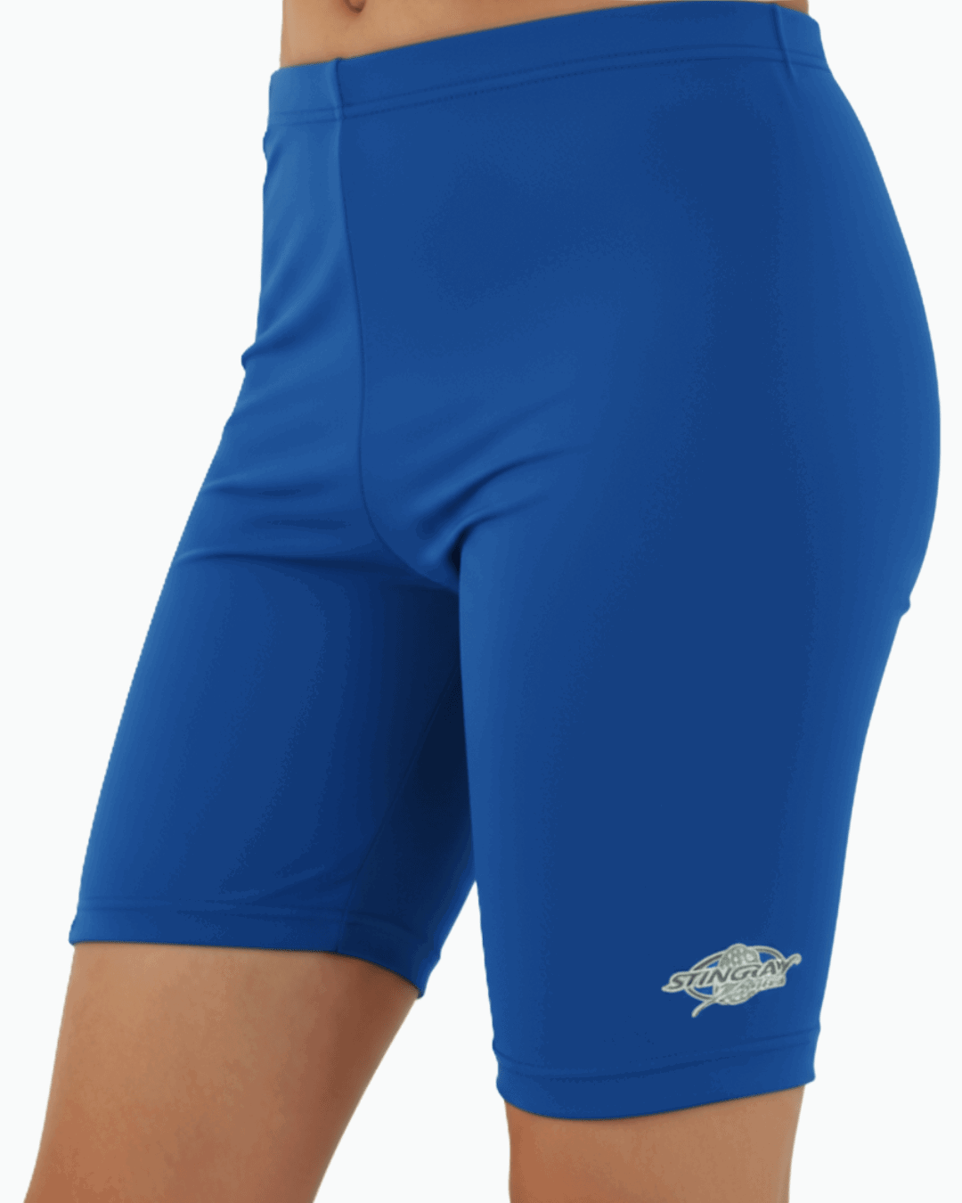 Child wearing blue upf 50+ swimming shorts with a Stingray logo on a white background