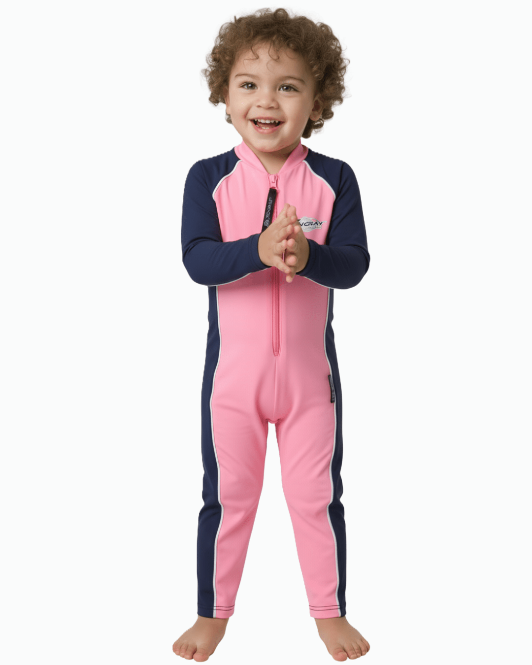 Toddler wearing a pink and navy UV swimsuit on a white background