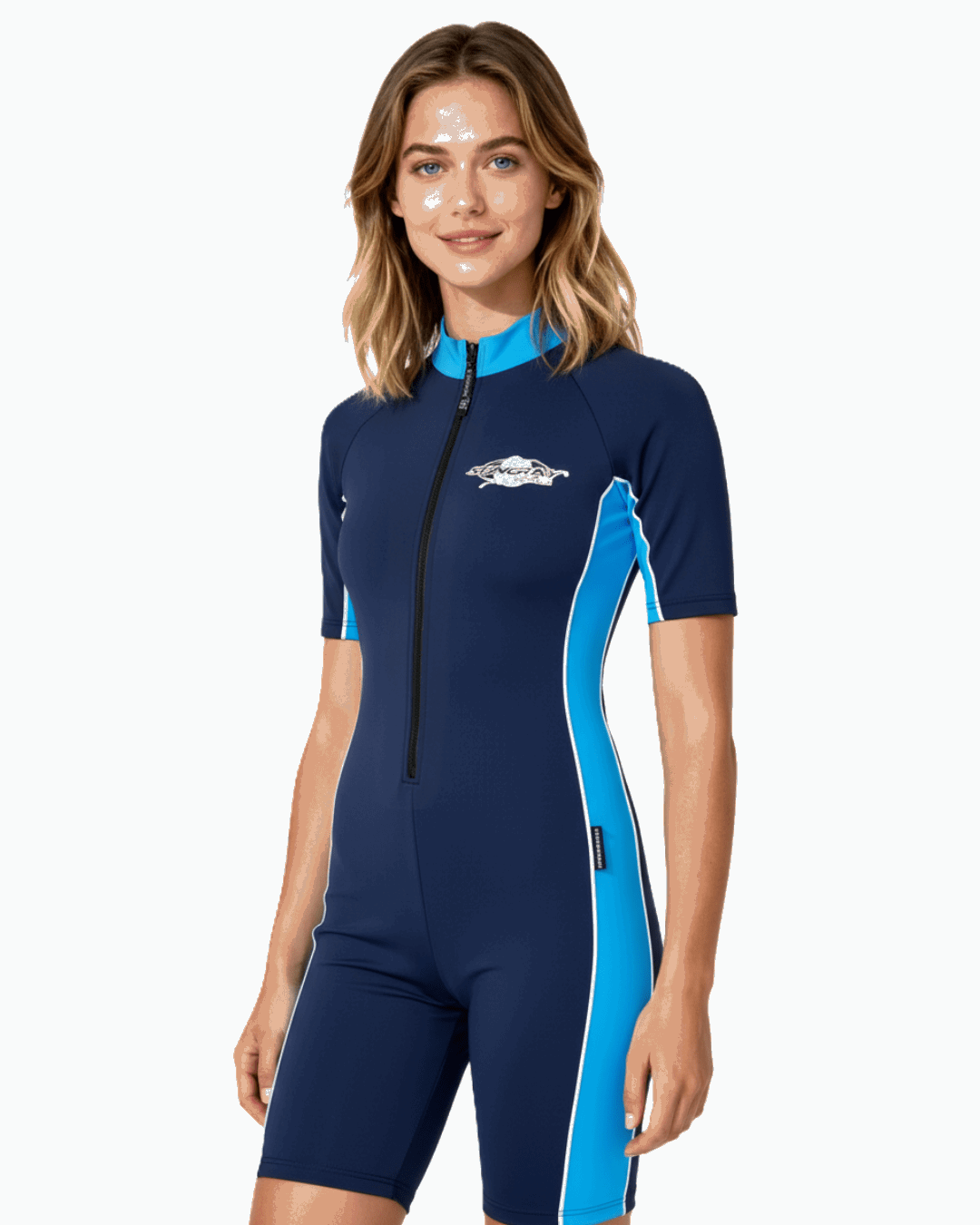 Woman wearing a navy and blue Sun safe sunsuit (UPF 50+) on a white background