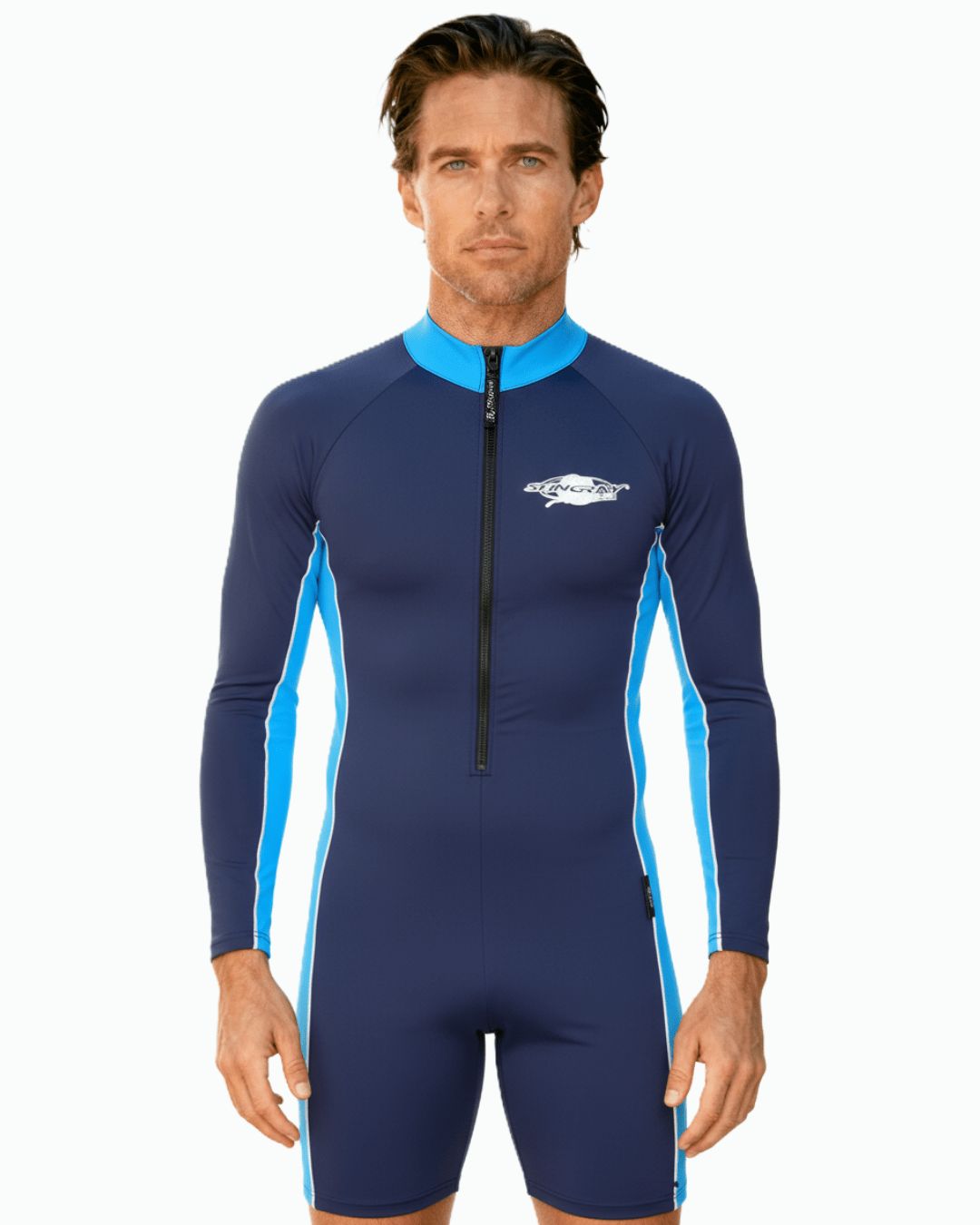 Man wearing long sleeve navy and blue UV protection sunsuit with a Stingray logo on a white background