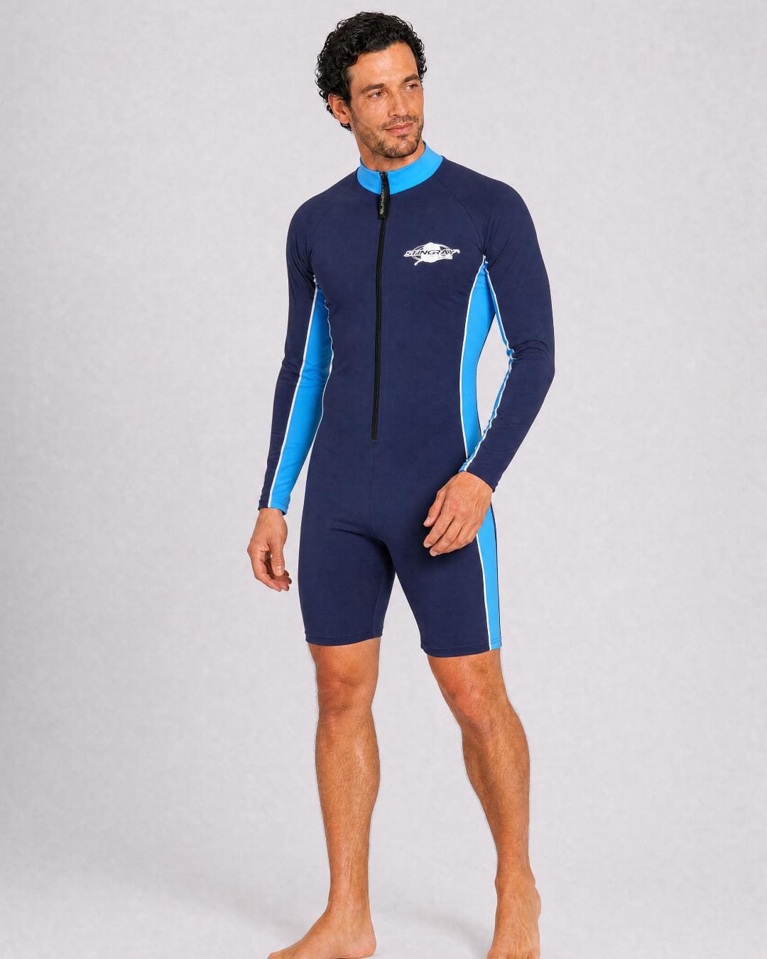 Man wearing a navy and azure long sleeve UV swimsuit UPF 50+ on a gray background