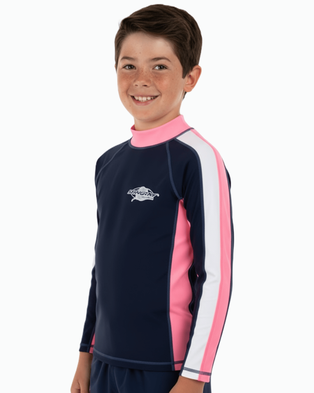 Boy wearing a navy and pink long-sleeve UV swim shirt with a Stingray logo on a white background