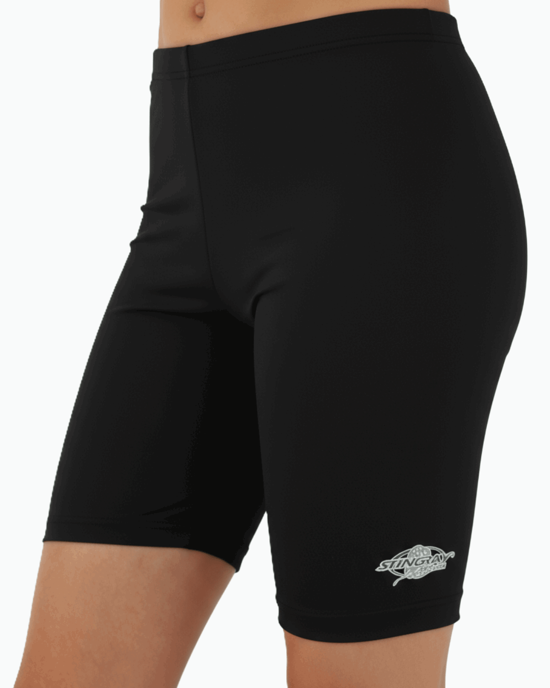 Child wearing black UPF 50+ swimming trunks with a Stingray logo on a white background