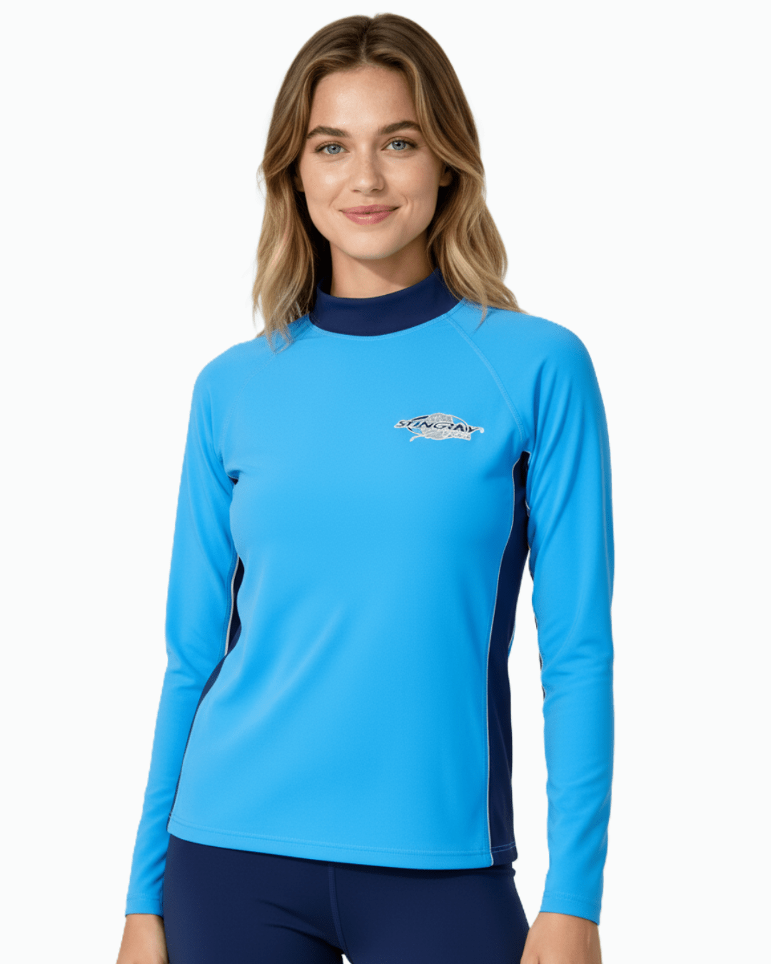 Woman wearing Stingray azure and navy unisex long sleeve rash shirt with UPF 50+ sun protection.