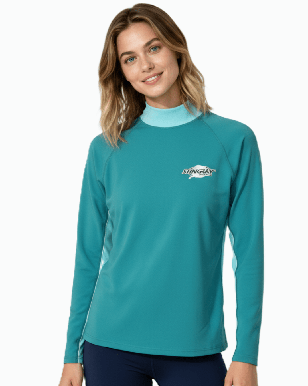 Woman wearing Stingray topaz/teal unisex long sleeve rash shirt with UPF 50+ sun protection.