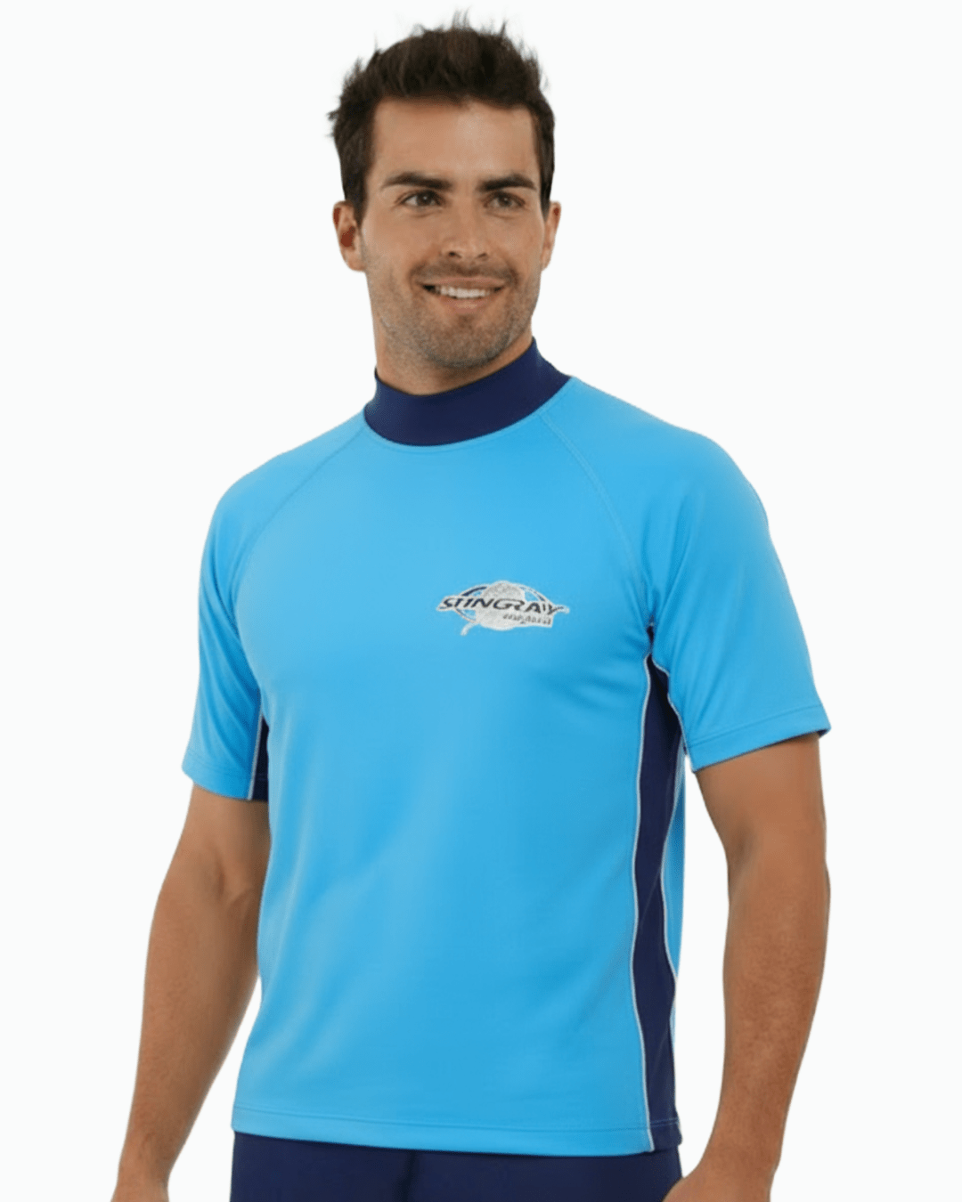 Man wearing azure and navy Stingray adult short sleeve rash shirt with UPF 50+ sun protection, made from chlorine-resistant fabric for outdoor and water activities.