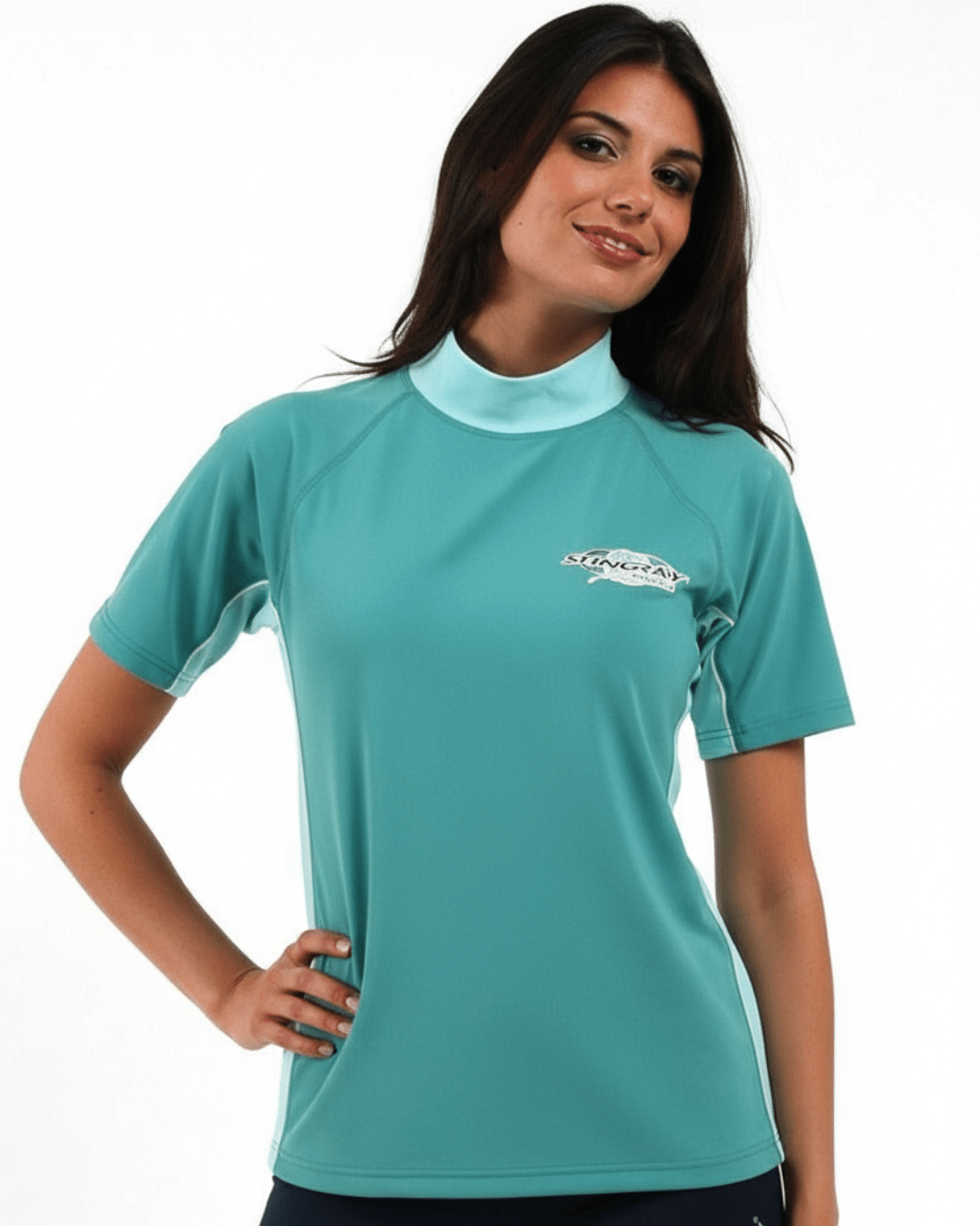 Woman wearing topaz and jade Stingray adult short sleeve rash shirt with UPF 50+ sun protection, made from chlorine-resistant fabric for outdoor and water activities.