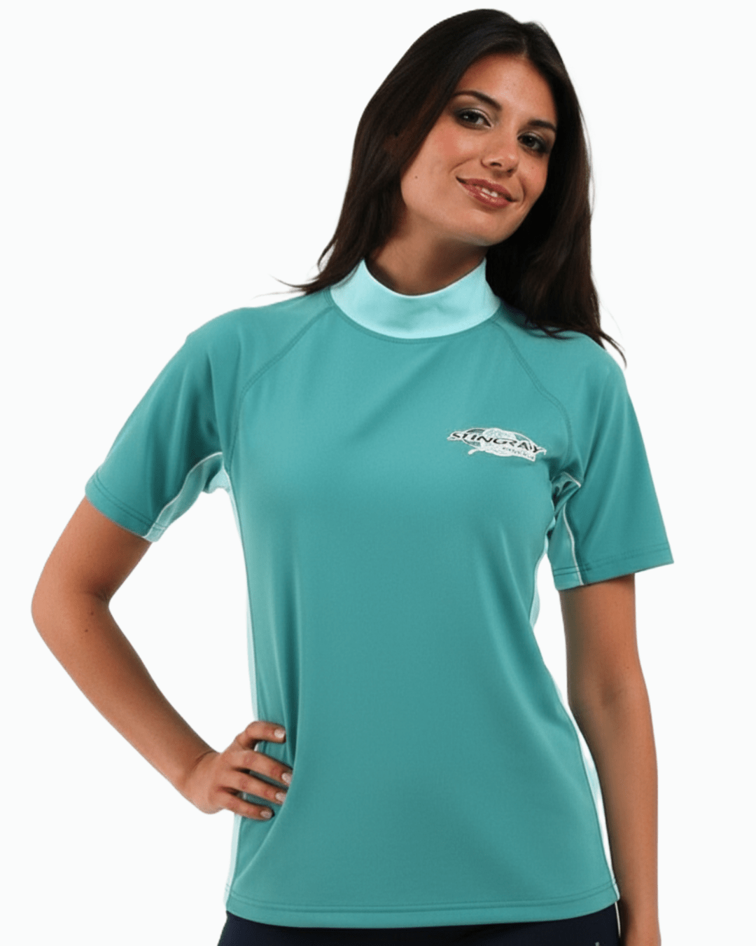 Woman wearing topaz and jade Stingray adult short sleeve rash shirt with UPF 50+ sun protection, made from chlorine-resistant fabric for outdoor and water activities.